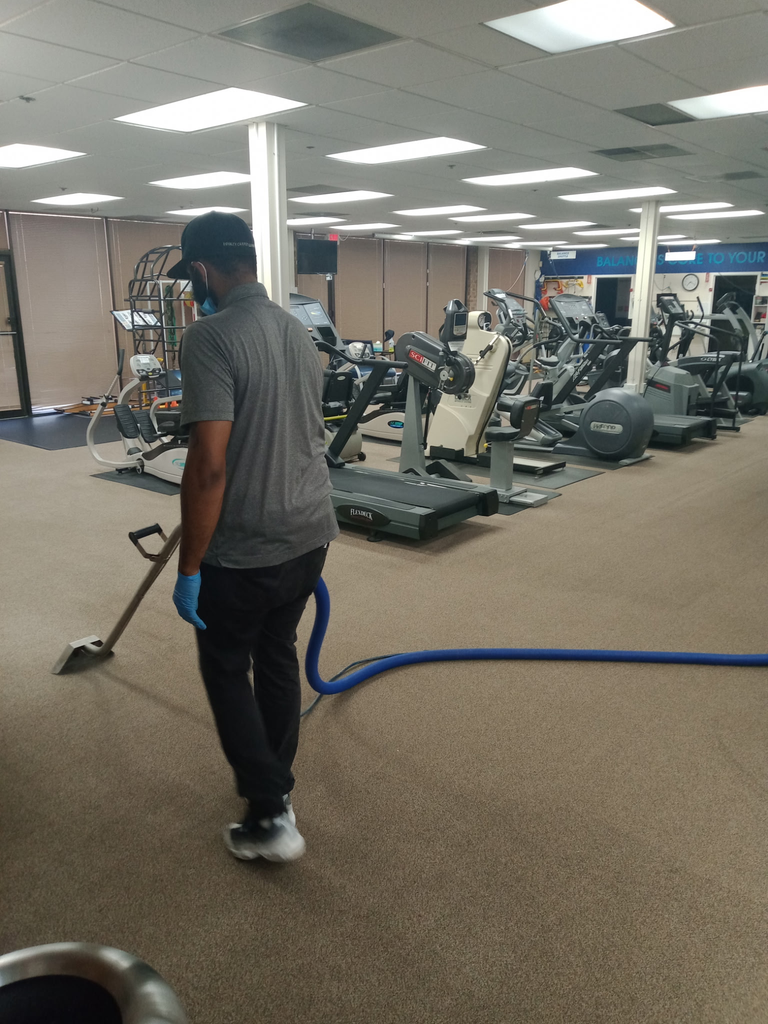 Royalty Cleaning technician professionally cleaning commercial carpet